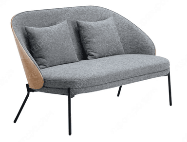 A contemporary two-seater loveseat featuring a curved, enveloping backrest and armrests, upholstered in a textured gray fabric. The loveseat includes two loose square back cushions. It is supported by slim, tapered black metal legs, with a subtle wooden trim visible on the exterior curve of the back. — 3D model