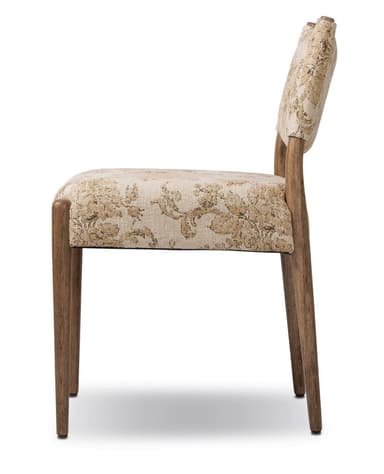 A side chair with a wooden frame and upholstered seat and back. The upholstery features a textured, floral pattern in beige and cream tones. The chair has four tapered wooden legs and a gently curved backrest. — 3D model