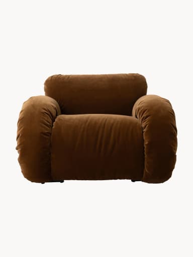 A brown velvet armchair with a rounded, overstuffed silhouette and a visible cream-colored tubular metal frame. The upholstery features deep tufting and ruching, creating a plush and voluminous appearance. The frame provides structural support and a distinctive visual element. — 3D model
