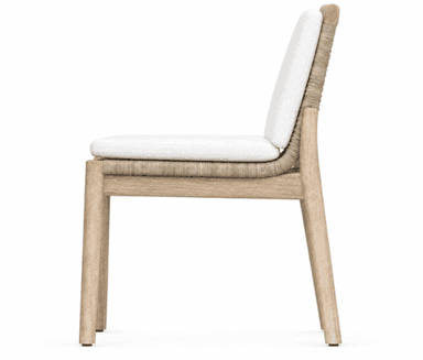 An armless dining chair featuring a light-toned solid wood frame, a seat base crafted from tightly woven natural fiber (appearing as rope or rattan), and removable upholstered cushions for both the seat and backrest in a white or off-white fabric. — 3D model