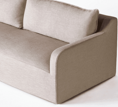 A sofa with a modern, minimalist design. It features a low profile, square arms, and two large back cushions. The upholstery appears to be a textured fabric with a neutral tone. — 3D model