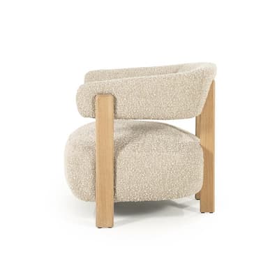 A modern armchair with a textured boucle upholstery and a wooden frame. The chair features a rounded seat and backrest, supported by four visible wooden legs and structural elements. The arms are integrated into the backrest structure. — 3D model