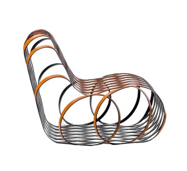 A modern, sculptural chair with an open, interwoven lattice structure. The chair's form is characterized by continuous, curved bands that create a dynamic, cage-like appearance, providing both support and visual lightness. The overall shape suggests a lounge or accent chair. — 3D model