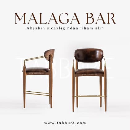 A modern bar stool featuring a rich brown wooden frame, dark brown leather upholstery for the seat and backrest, and elegant brass accents that form the armrests and footrest. The design incorporates tapered legs and a gently curved back. — 3D model
