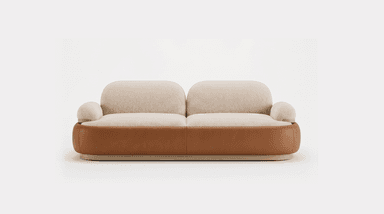 A contemporary two-seater loveseat featuring a dual-material design. The upper seating area, including the back cushions, seat cushions, and armrests, is upholstered in a light cream-colored, textured bouclé fabric, offering a soft and inviting appearance. The back and seat cushions are distinct, plump, and rounded. The lower perimeter of the sofa is encased in a smooth, curved tan-brown leather or faux leather panel, which provides a contrasting texture and color. This leather section is subtly elevated by a thin, light-toned wooden plinth base that forms the lowest part of the furniture piece, completing its minimalist and elegant aesthetic. — 3D model