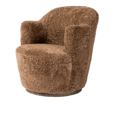 A plush, upholstered armchair with a rounded silhouette. The chair features a barrel-shaped base and a high, enveloping backrest that curves into armrests. The upholstery has a textured, shaggy appearance, resembling sheepskin or a similar natural fiber. — 3D model