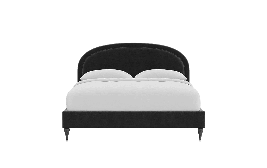 A dark grey upholstered bed frame with a curved headboard. The bed includes two white pillows and is supported by four short, dark-colored legs with subtle detailing near the feet. — 3D model