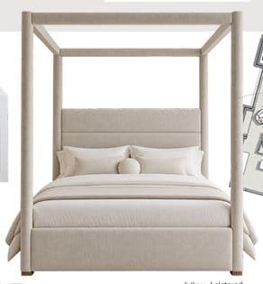 An upholstered four-poster canopy bed featuring a minimalist design. The entire frame, including the headboard, footboard, side rails, and the four vertical posts supporting the canopy structure, is covered in a light beige or off-white fabric. The headboard has a slight recline and a paneled, upholstered appearance. The bed is dressed with matching neutral-toned bedding, including a mattress, fitted sheet, duvet, pillows, and a throw blanket. Small, discreet golden feet are visible at the base. — 3D model