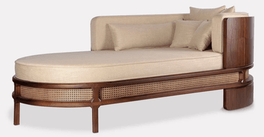An elegant single-armed chaise lounge featuring a dark walnut wood frame with intricate cane webbing detail and plush upholstered cushions in a neutral beige fabric. — 3D model