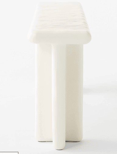 A minimalist bench with a rectangular seat and two vertical supports that appear to be fused or molded together in a single piece. The edges of the seat are rounded. The structure has a clean, modern aesthetic. — 3D model