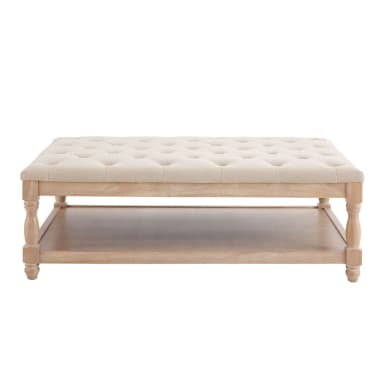 A rectangular coffee table with a tufted upholstered top and a lower wooden shelf. The table features turned legs and a light wood finish. — 3D model
