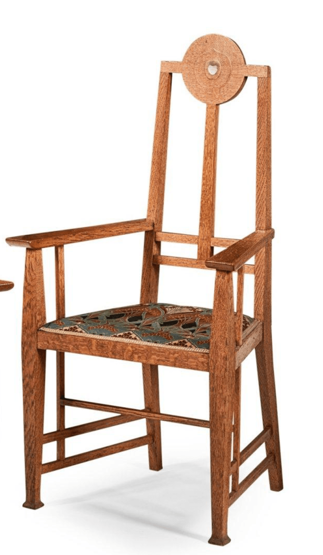 A wooden armchair with a tall, spindle-back design, featuring a circular motif at the top and upholstered seat with a patterned fabric. — 3D model