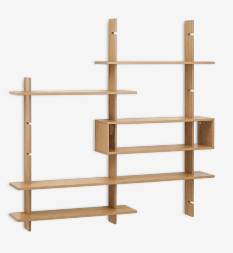 A modern modular wall-mounted shelving system constructed from light-toned wood. It features several vertical uprights with slotted designs, allowing for adjustable shelf placement. The system includes multiple flat shelves of varying lengths and one integrated rectangular box-shaped storage unit. The design is minimalist and functional, providing flexible storage and display options. — 3D model