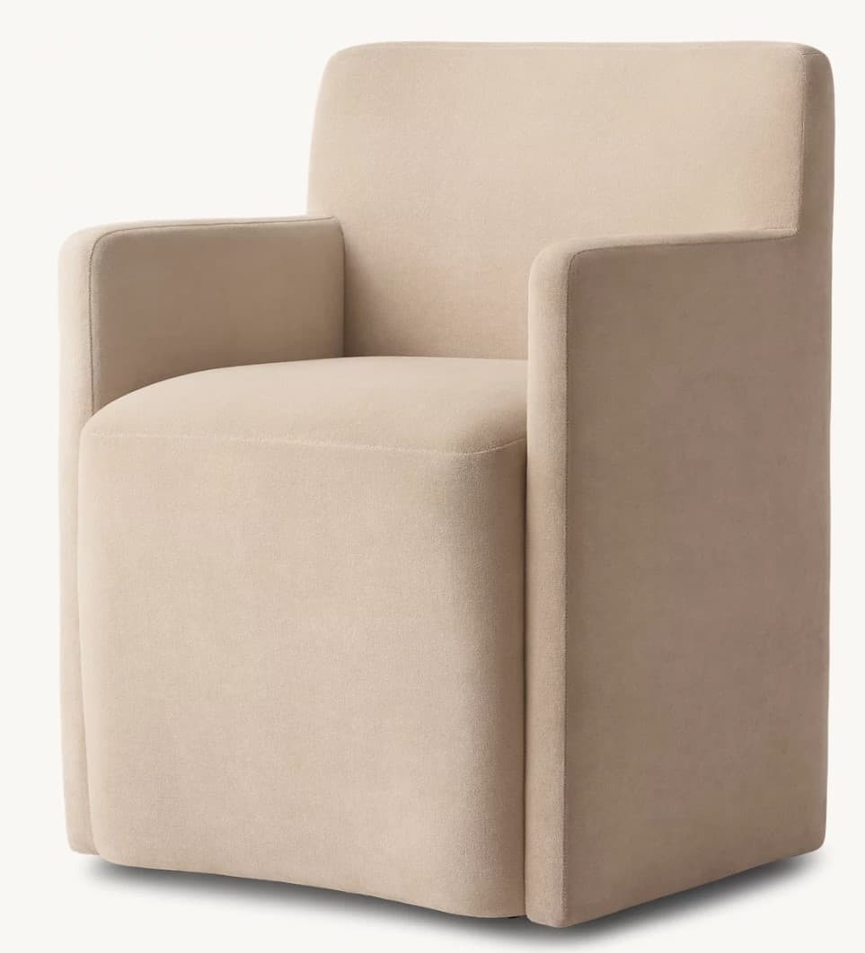 A modern upholstered armchair with a clean, blocky silhouette. It features integrated arms that are flush with the seat and backrest, creating a continuous, boxy form. The upholstery appears to be a soft, textured fabric with minimal visible stitching, contributing to a minimalist aesthetic. — 3D model
