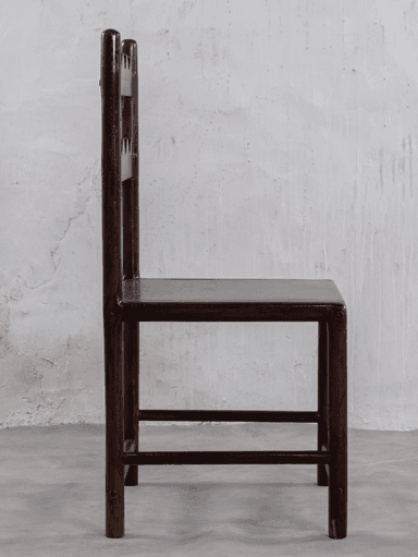 A dark-stained wooden chair featuring a distinctive backrest with two horizontal slats, each carved with a wavy or scalloped edge. It has a simple square wooden seat and straight legs with stretchers. — 3D model