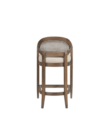 A bar stool with a wooden frame, featuring a woven cane backrest within an oval frame, and a cushioned seat. The stool has armrests and four legs connected by a lower footrest structure. — 3D model