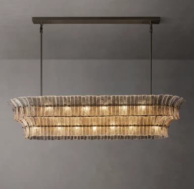 A sophisticated rectangular chandelier featuring multiple layers of textured, clear glass panels suspended within a black metal frame. The panels are arranged horizontally, creating a diffuse, warm glow from the internal light sources. The fixture is suspended by two thin rods from a rectangular black canopy, suggesting a modern or transitional aesthetic. — 3D model