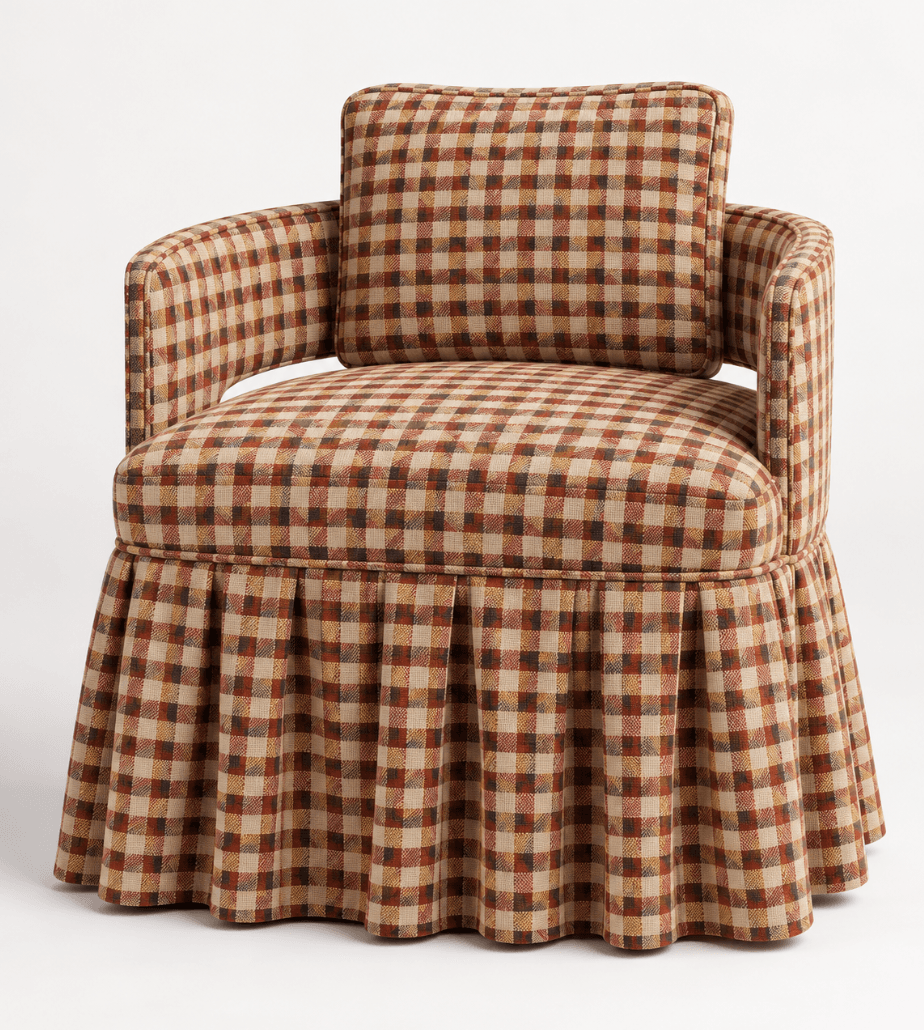 A fully upholstered armchair featuring a multicolored gingham plaid fabric in hues of brown, red, orange, and beige. The chair has a rounded back and arms, with a separate back cushion and a pleated skirt covering the base. — 3D model