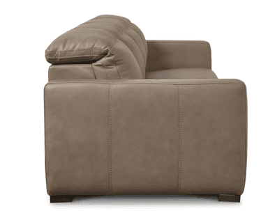 A four-seater sofa with plush cushions and a streamlined design. The sofa features distinct seat cushions and back cushions, with visible stitching along the edges. It has square arms and is supported by short, dark wooden legs. — 3D model