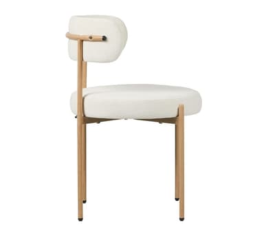 A contemporary accent chair featuring a boucle upholstered seat and backrest, supported by slender, light-colored wooden legs. The chair has a minimalist design with a gently curved back and a round seat, embodying a soft, inviting aesthetic. The contrasting textures of the plush boucle fabric and the smooth wood create visual interest. Its slender profile and neutral color palette make it a versatile addition to various interior settings. — 3D model