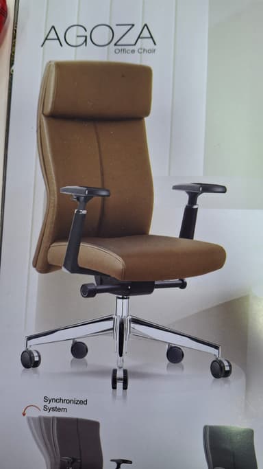 A high-back executive office chair upholstered in brown leather, featuring a padded seat, tall backrest with integrated headrest, and black fixed-height armrests. It sits on a polished chrome five-star swivel base with black rolling casters. — 3D model