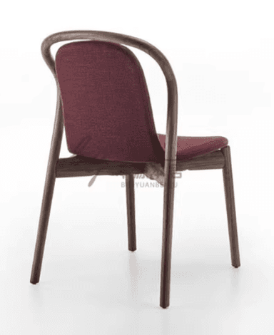A modern dining chair with a curved wooden frame and a upholstered seat and backrest. The chair features slender, bentwood legs and armrests that merge into the back support. The upholstery is a textured, dark red fabric. — 3D model