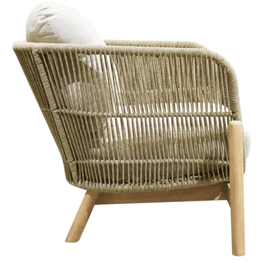 An outdoor lounge chair featuring a sturdy light-toned solid wood frame and a body constructed from tightly woven synthetic rope in a beige or tan color. The chair includes off-white fabric cushions for both the seat and back, providing comfort against the open-weave design. The wooden legs are slightly tapered, contributing to a contemporary and relaxed aesthetic suitable for outdoor environments. — 3D model