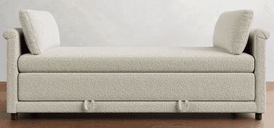 A light-colored sofa bed with a textured fabric upholstery. It features a streamlined design with a low profile, rolled arms on one side, and two distinct back cushions. The front of the sofa shows two pull handles, indicating its function as a sofa bed. — 3D model
