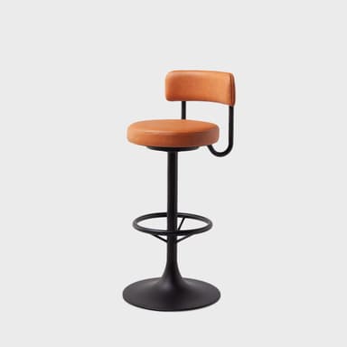 A black metal bar stool with a circular base, a central pedestal, and a footrest ring. The seat and backrest are upholstered in a tan, textured material, resembling leather. The backrest is a low, curved piece attached to a black metal arm that extends from beneath the seat. — 3D model