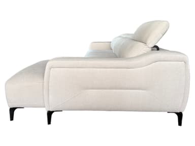 A light gray sectional sofa with a chaise lounge extension. The sofa features plush cushions and a modern design with angular armrests and subtly decorative stitching on the sides. It is supported by slender, dark-colored legs. — 3D model
