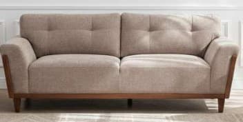 A contemporary two-seater sofa featuring a light beige fabric upholstery and an exposed medium-brown wood frame. The sofa has two seat cushions and two back cushions, with the back cushions featuring simple button tufting. The arms are slightly rolled and transition into the wooden frame, which extends along the front and sides and forms four tapered legs. — 3D model