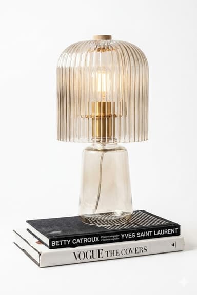 A contemporary table lamp featuring a smoked amber-tinted glass construction. The lamp consists of a cylindrical shade with prominent vertical fluting, resting on a smooth, tapered conical base. An exposed light bulb is visible inside the shade, housed within a brass-finished socket. A small, circular wooden finial caps the very top of the fluted shade. The design emphasizes texture and warm light diffusion. — 3D model
