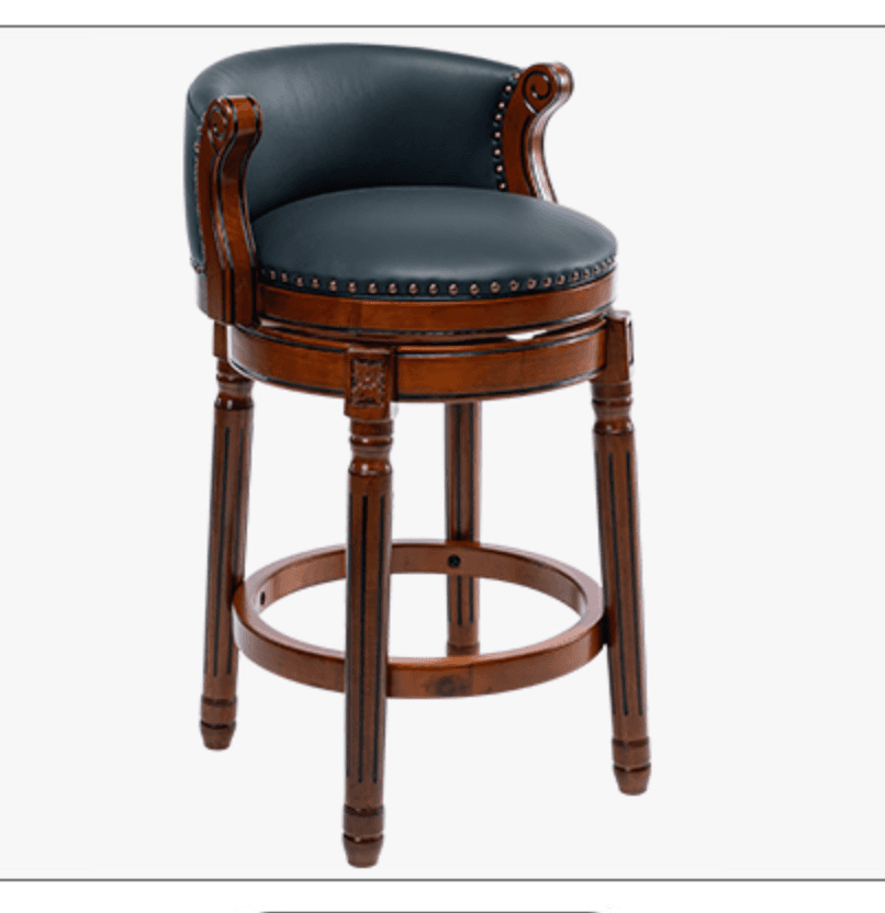 A traditional style bar stool featuring a round, padded, upholstered seat and backrest with armrests, set on a dark wooden frame. The upholstery is a dark green leather or faux leather, adorned with brass nailhead trim around the seat and back perimeter. The wooden frame exhibits a rich, dark brown finish with ornate carvings on the armrests and above the legs. It has four turned and reeded legs connected by a circular footrest, and the seat is designed to swivel. — 3D model