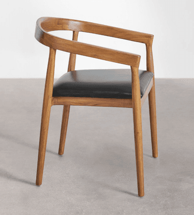 A Mid-Century Modern dining chair featuring a warm-toned wooden frame and a black upholstered seat. The backrest is gently curved, integrating seamlessly with the armrests. The chair stands on four tapered legs. — 3D model