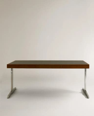 A sophisticated Mid-Century Modern executive desk featuring a rectangular wooden top with a dark inset surface, likely leather or laminate. It includes two integrated drawers and is supported by two polished metal, inverted T-shaped legs, embodying a minimalist design. — 3D model