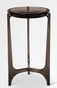 A tall, slender side table with a circular top and three legs that splay outwards. — 3D model