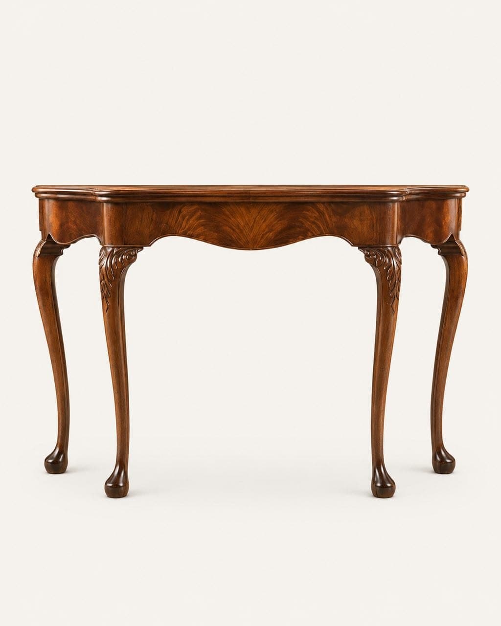 A classic Queen Anne style console table, crafted from dark brown wood with a rich grain, possibly walnut or mahogany. It features a serpentine or scalloped apron, cabriole legs, and carved acanthus leaf detailing on the knees of the front legs. The table top has a subtle beveled edge and appears to feature a burled wood veneer pattern in the center. The feet are pad or club feet. The overall design emphasizes elegant curves and detailed craftsmanship. — 3D model