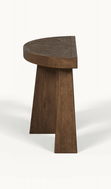 A semi-circular console table with a solid wooden top and three trapezoidal legs. The wood grain is prominent on the surface, suggesting a natural finish. The design is minimalist and geometric. — 3D model
