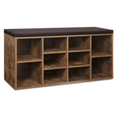 A rectangular storage bench featuring a distressed wood-look finish, multiple open cubby compartments for storage, and a dark, padded fabric cushion on top for seating. The unit is designed for functional organization and provides a rustic aesthetic. — 3D model