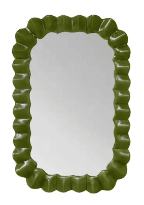 A decorative mirror with an oval-shaped reflective surface and a distinctively scalloped or ruffled frame. The frame is glossy and appears to be made of molded material, possibly resin or lacquered metal. The color is a vibrant, uniform green. — 3D model