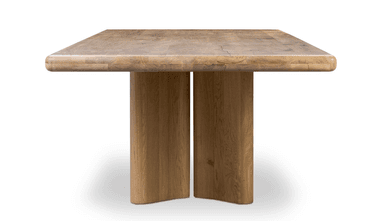 A modern rectangular dining table crafted from light-colored solid wood, likely oak, featuring a thick tabletop with softened edges supported by two prominent, rectangular pedestal bases. — 3D model