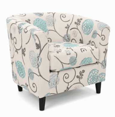 An upholstered barrel armchair featuring a cream-colored fabric with a distinctive floral and scroll pattern in teal and grey. The chair has a rounded back and integrated arms, with a separate seat cushion. It is supported by four short, tapered black legs. — 3D model