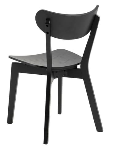 A modern chair with a curved backrest and a slightly angular seat. The chair features four legs and appears to be constructed from molded wood or a wood composite. It has a minimalist design with visible joinery points. — 3D model