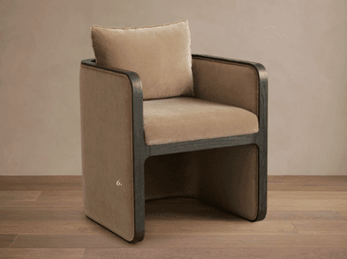 A modern armchair with a curved back and a separate headrest cushion. The armchair features a velour-like fabric upholstery in a neutral beige tone, contrasted with dark wood accents framing the back and sides. The wood elements appear to have a subtle grain pattern. The overall design suggests a contemporary or transitional style. — 3D model