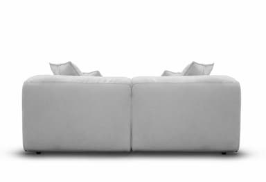 A contemporary, light gray two-seater sofa featuring a plush and inviting design. It consists of two main upholstered sections, providing generous seating. The sofa has thick, soft cushions for both the seat and back, along with several matching throw pillows, all upholstered in a uniform light gray fabric with subtle piping detail. The armrests are wide and softly padded, integrated into the overall plush aesthetic. The piece appears designed for maximum comfort and relaxation, with a low profile and a substantial, inviting presence. — 3D model