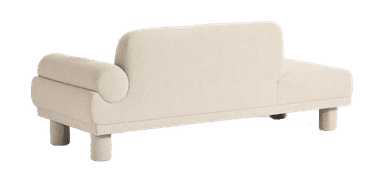 A contemporary bouclé sofa with a chaise lounge extension on the right side. It features a low-profile design with cylindrical legs and a rounded armrest. The backrest is asymmetrical, with a taller section on the left. — 3D model