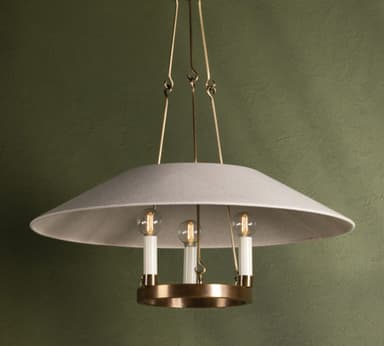 A modern chandelier featuring a wide, shallow, inverted dome-shaped lampshade made of light gray fabric. Beneath the fabric shade, a polished brass ring holds three vertically oriented light sockets, each fitted with a candle-style LED bulb. The fixture is suspended by thin brass rods, contributing to its minimalist and elegant aesthetic. The light emitted by the bulbs is diffused by the fabric shade, creating a soft, ambient glow. — 3D model