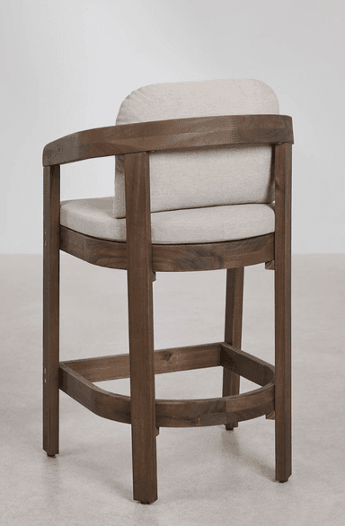 A modern dark brown wooden bar stool with upholstered seat and back cushions in a light beige fabric. It features curved armrests that seamlessly integrate into the back support and frame, along with a square footrest bar for comfort. The design is clean and contemporary. — 3D model