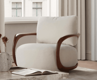 An elegant modern lounge chair featuring a light cream-colored upholstered seat and back, supported by a distinctive dark-toned, curved wooden frame that functions as both armrests and a partial base. — 3D model