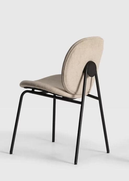 A modern upholstered chair with a curved backrest and a metal frame. The seat and back are covered in a light-colored, textured fabric. The frame consists of thin, black metal legs that meet at the base and extend upwards to support the seat and back. A distinct circular element is visible connecting the backrest to the rear legs. — 3D model